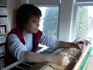 Xiaodan Liu regulating a grand piano action