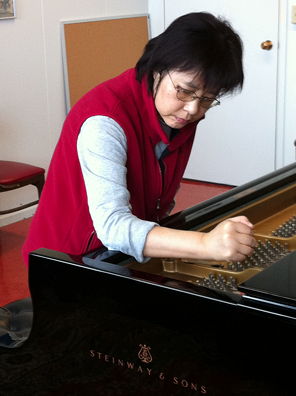 Xiaodan Liu tuning a Steinway concert grand